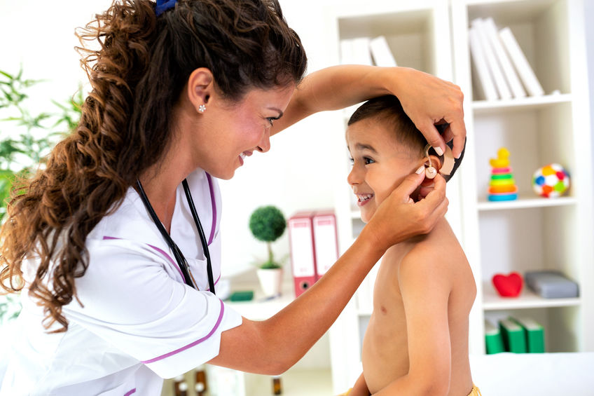 Little boy getting his hearing aids