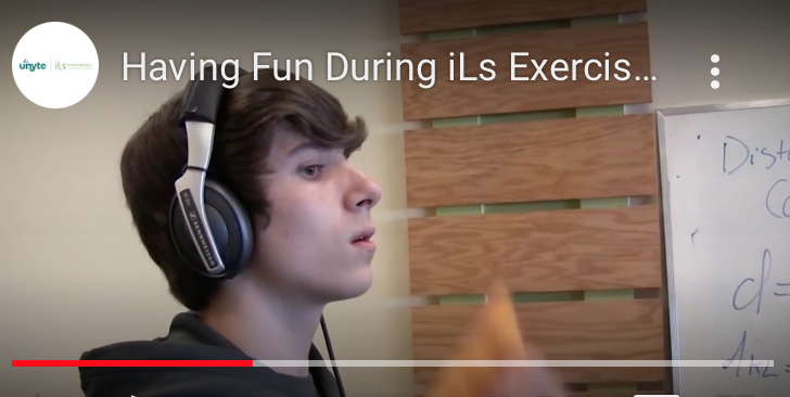 Teenage boy tracking an object with just his eyes while listening to an iLs Integrated auditory training program.